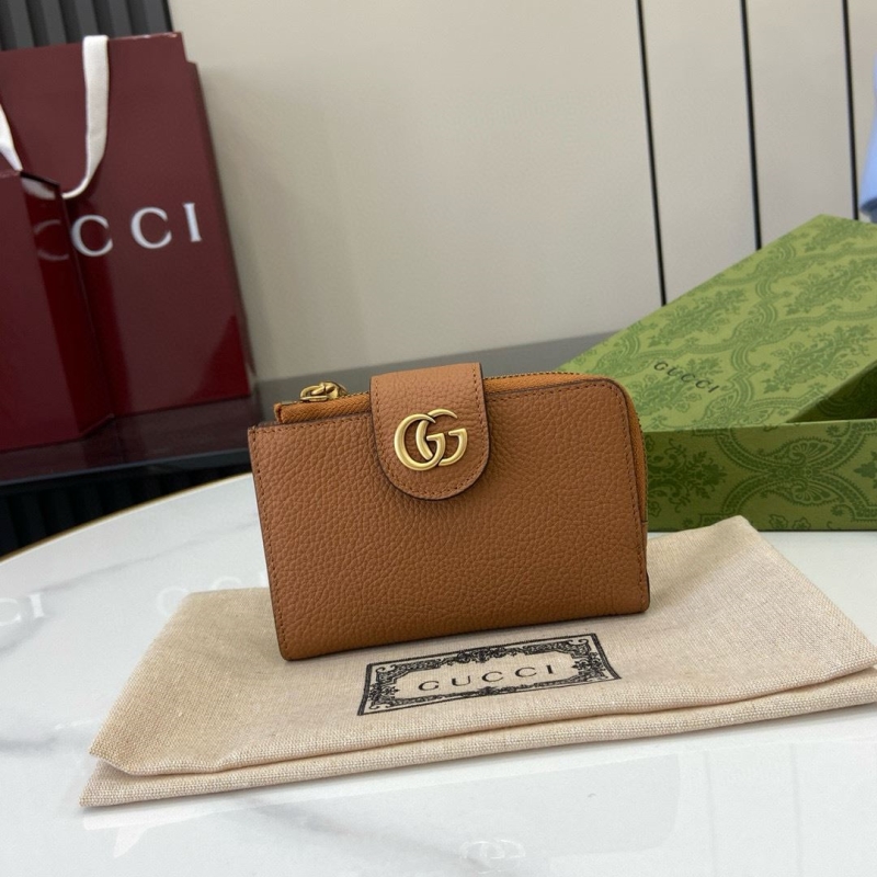 G*u*i clutch bags